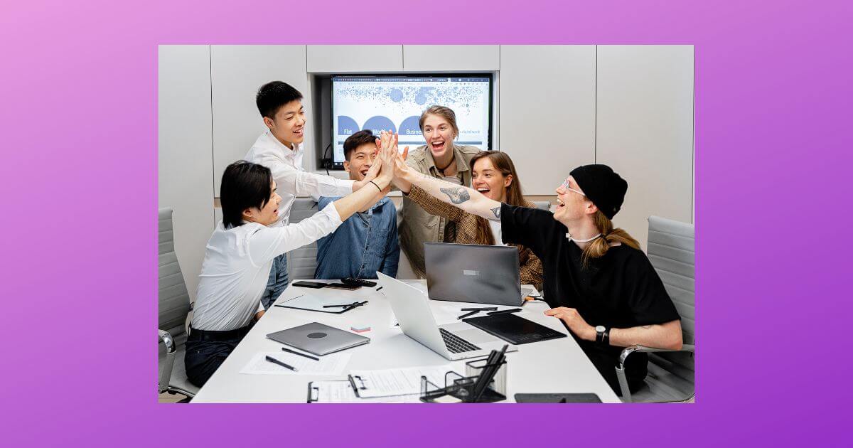 Team of employees clapping their hands today surrounded by a purple boarder.